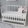 Дитяче ліжечкоко Карпати біле з безшумним маятниковим механізмом зі стопором
